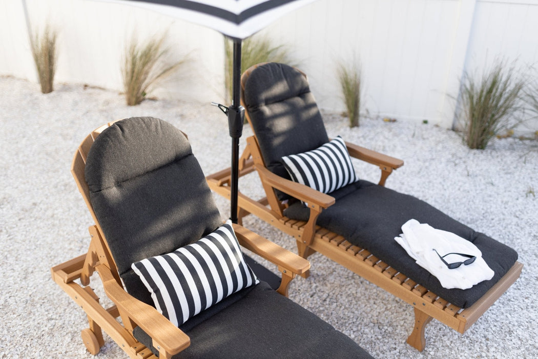 Berlin Gardens Comfo Back Chaise Lounges in Natural Teak. Cushions in Heritage Char. Pillows in Regatta Ebony