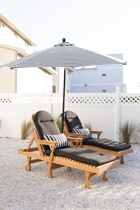 Berlin Gardens Comfo Back Chaise Lounges in Natural Teak. Cushions in Heritage Char. Pillows and Umbrella in Regatta Ebony