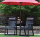 Berlin Gardens Comfo Back Counter Chairs in black under red umbrella