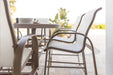 Murphy 42” x 76” Oblong Bar Table in Clay with Murphy Sling Bar Chairs and Murphy Bar Height Padded Sling Swivel Chairs in Clay, sling in Sailing Salt