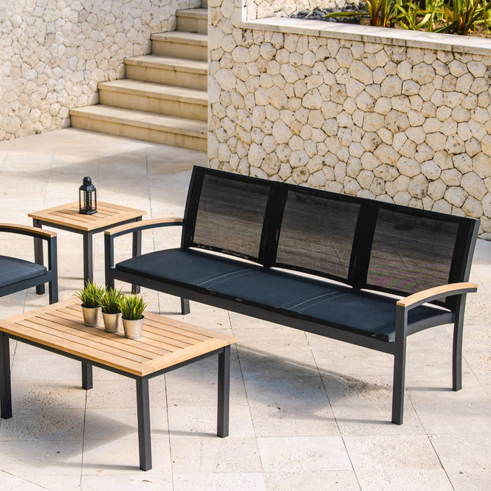 Three Birds Casual Tribeca 3-Seater Settee with other Tribeca pieces in a stone patio space